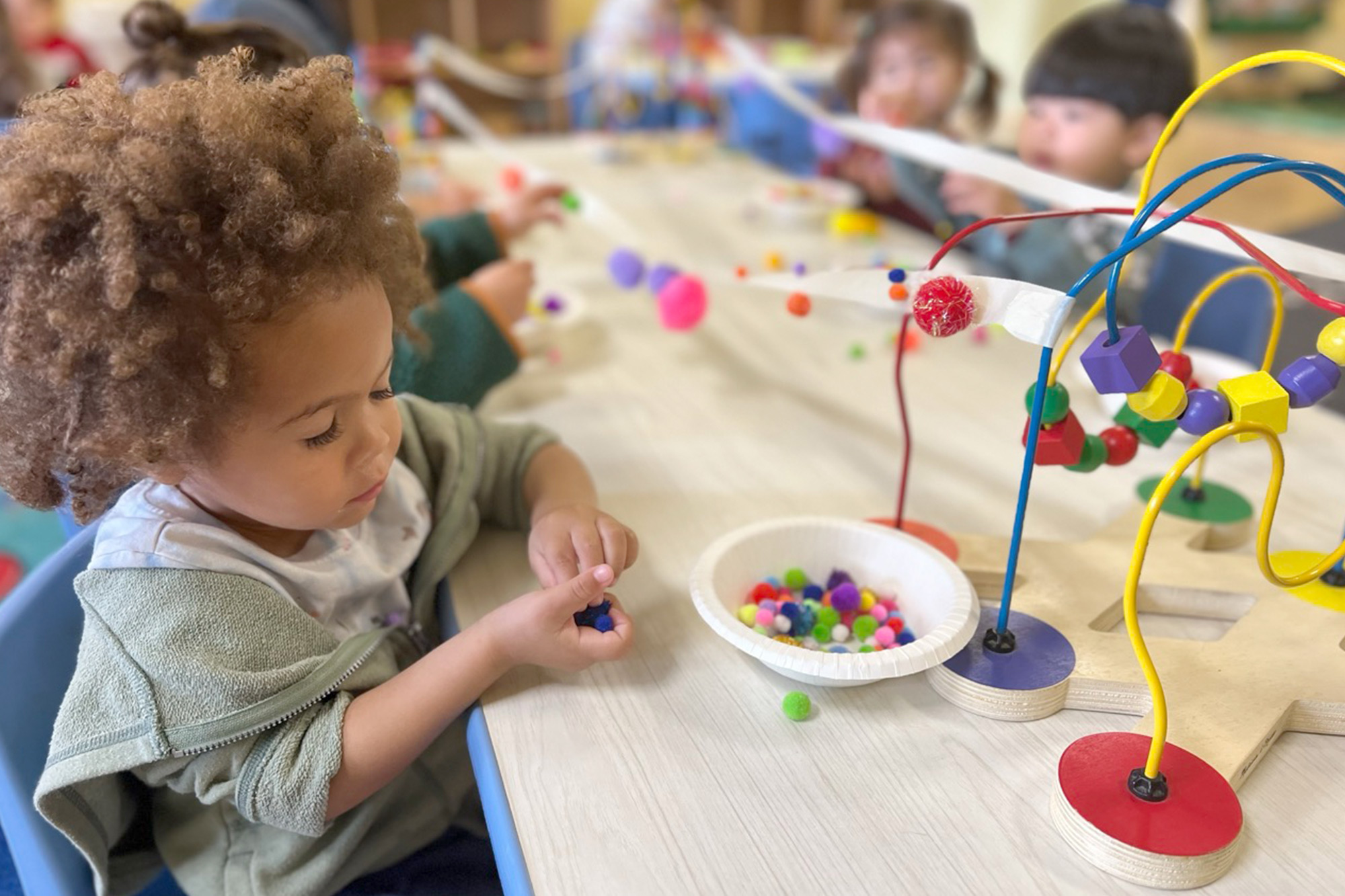 Toddler in Placentia Preschool enjoying outdoor playtime