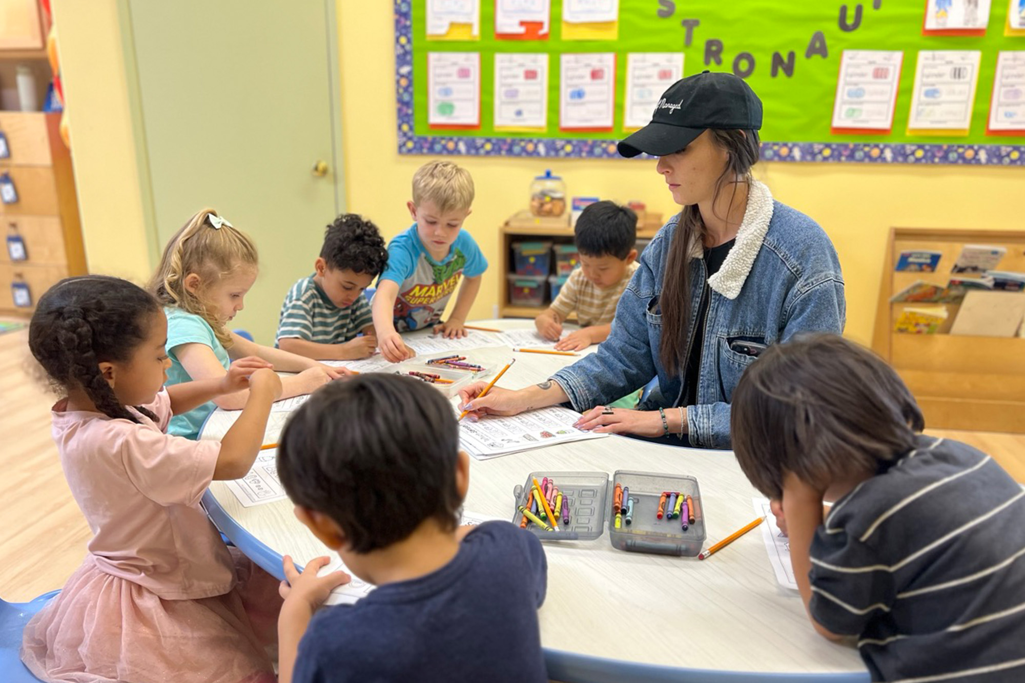 Teachers and staff at Brea Preschool interacting with children.